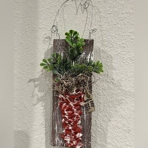 Adorable spring carrot wall hanging with wire handle.